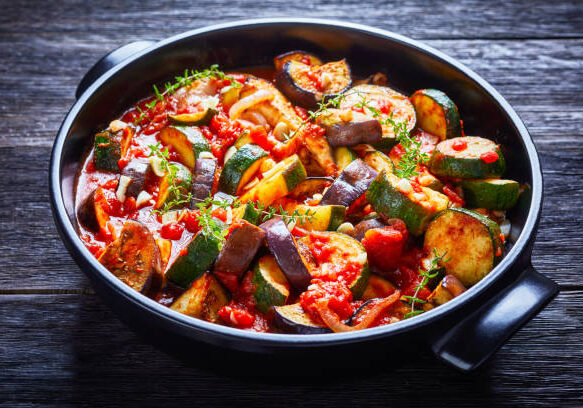 veggies ragout in a black ceramic dish